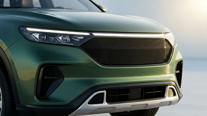 Maruti Grand Vitara ফেসলিফট ২০২৬-এর নতুন গ্রিল ও LED হেডল্যাম্প ক্লোজ-আপ — গাঢ় ফরেস্ট-গ্রিন রঙে পরিবর্তিত মেশ ব্ল্যাক গ্রিল, ক্রোম-লেস কনটেম্পরারি ডিজাইন, লেভেল-২ ADAS এসইউভি ফেসিয়াল আপগ্রেড
